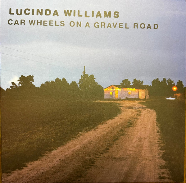 Car Wheels On A Gravel Road